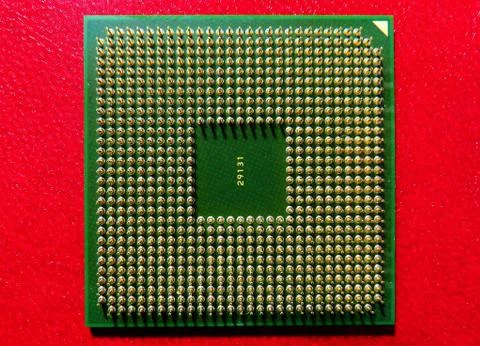 A closeup shot of Computer CPU (central processor unit) chip isolated on a re Stock Photos