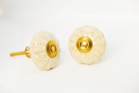 Closeup shot of decorative cover knobs isolated on a white background Foto stock