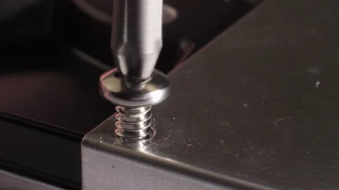 Closeup shot of detaching a screw from a hard drive. Selective focus. Stock Footage 211893794