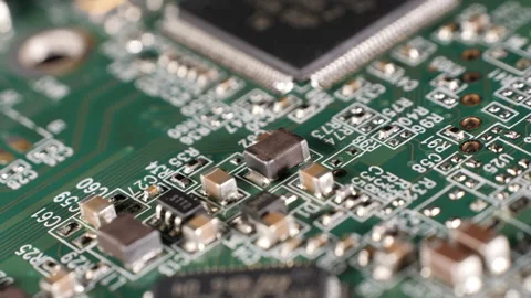 Closeup shot of different components on a microchip of a hard drive. Defocused Stock Footage 265078754