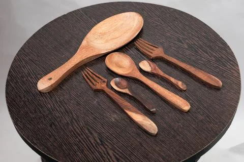 Closeup shot of different size spoons and forks Stock Photos
