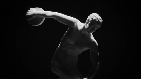 Closeup shot of the Discus Thrower marble sculpture slowly rotating on a black Stock Footage 254144944