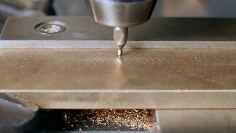Closeup shot of drilling machine making hole with a drill bit in metal plate Stock Footage 114802741