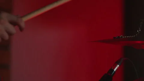 A closeup shot of drums features dramatic lighting, creating an artistic and Stock Footage 303888842