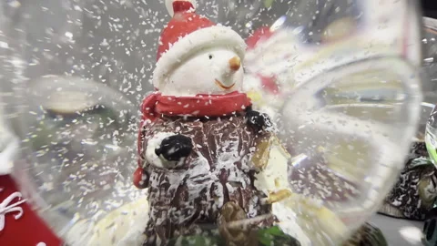 Closeup shot of a dwarf snowglobe.Gnome inside of the glass ball. Vídeos de archivo 293869821