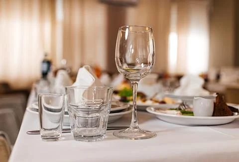 Closeup shot of empty wine glasses on the table Stock Photos