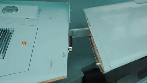 Closeup shot of engineer connects wing to unmanned aerial vehicle. Military Stock Footage 129994872