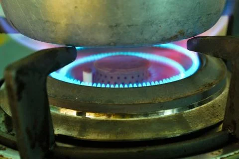 Closeup shot of fire from gas kitchen stove. Stock Photos
