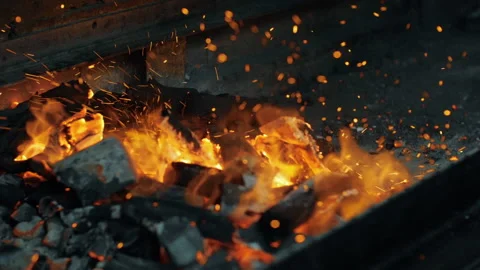 Closeup shot of fire sparks moving on dark at black background coming from Stock Footage 136667161