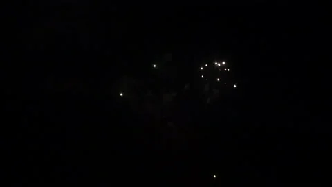 Closeup shot of fireworks exploding in the night sky. Explosion of pyrotechnics. Stock Footage 212371124