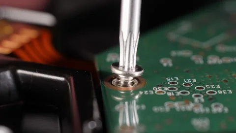 Closeup shot of fixing a hard drive. Screwdriver. Selective focus. Stock Footage 266846845