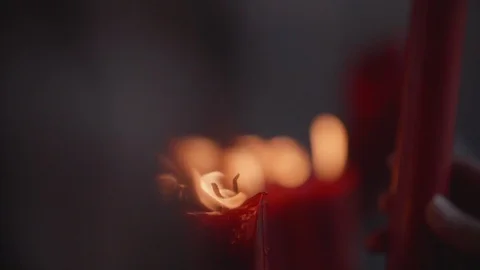 A closeup shot of flame on candle in slow motion Stock Footage 88849525