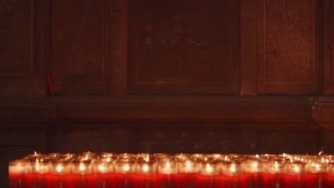 A closeup shot of flame on candle in slow motion Stock Footage 88850563