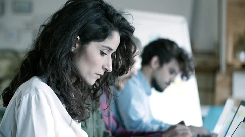 Closeup shot of focused female developer working with laptop 動画素材 121401798