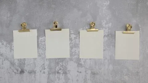 Closeup shot of four white sheets hanged on a grey wall Stock Illustration