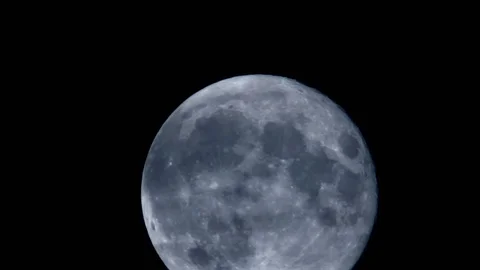 Closeup shot of full moon moving across the black night sky. Stock Footage 105200239