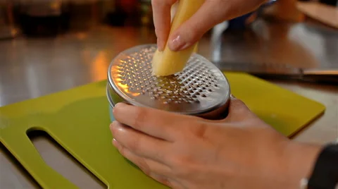 Closeup shot grating cheese with metall grater 動画素材 65287682