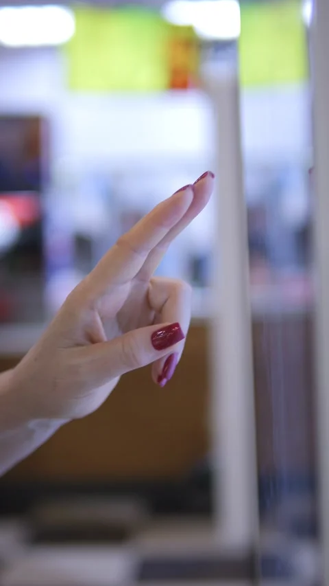 A CloseUp Shot of a Hand Gracefully Touching a Digital Screen or Display Surface Stock Footage 284909489