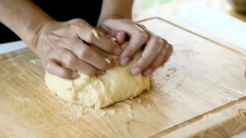 Closeup shot of hands Baker kneading dough flour on table, Close-up kitchen.. Stock Footage 272469633