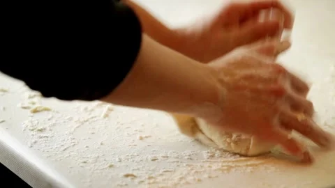 Closeup shot of hands chef bakery man kneading dough applying flour on doug.. Stock Footage 272469588