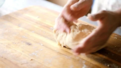 Closeup shot of hands chef bakery man kneading dough applying flour on doug.. Stock Footage 272469593