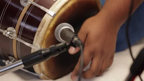 Closeup shot of hands of a Man playing Dholak Stockbeeldmateriaal 316301760