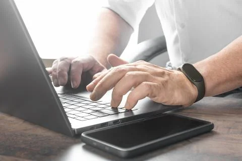 Closeup shot hands using laptop computer and internet, typing on keyboard, .. Stock Photos