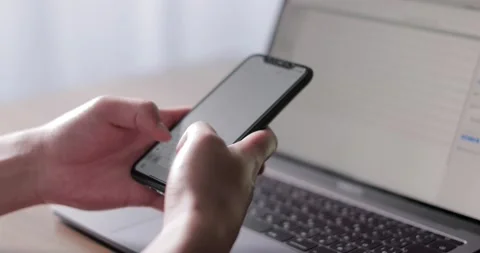 Closeup shot of hands using smartphone Видео 138341130