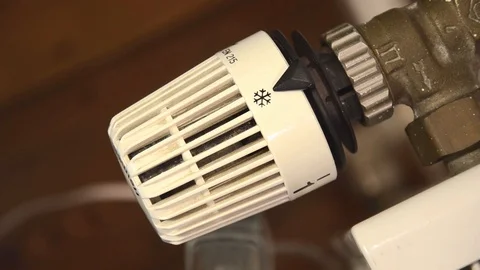 Closeup shot of heating control (turning the heating up) Stock Footage 122060038