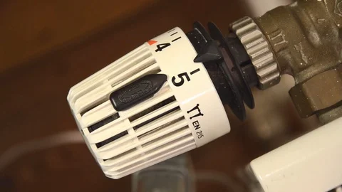 Closeup shot of heating control (turning the heating down) Stock Footage 122076068