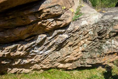 Closeup shot of huge Stone layers with sunlight 스톡 사진