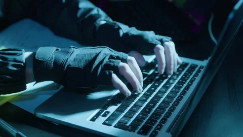 Closeup shot of human hands in fingerless gloves typing Stock Footage 181817572