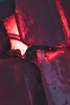 Closeup shot of ice cubes under red light Stock Photos