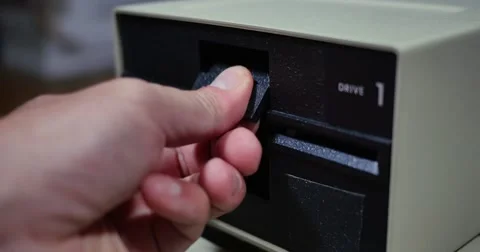 Closeup Shot Inserting and Removing 5.25-inch Floppy Drive  	 Stock Footage 67299842