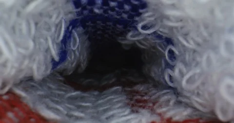 Closeup shot of inside of knit blankets, zooming out to reveal folded blankets Stock Footage 105576604