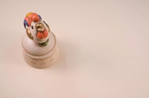 Closeup shot of a kitchen timer on a white background Stock Photos