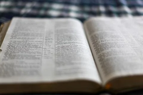 Closeup shot with linear tilt shift of the open Holy Bible Stock Photos