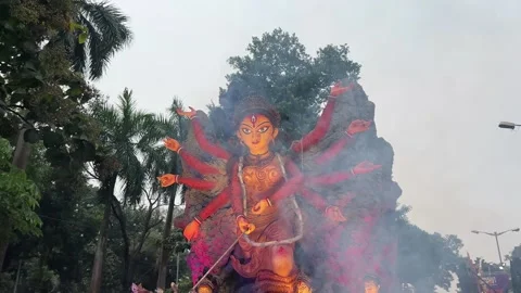 Closeup shot of Maa Durga Idol getting ready for Durga Puja procession at red Video stock 294353003