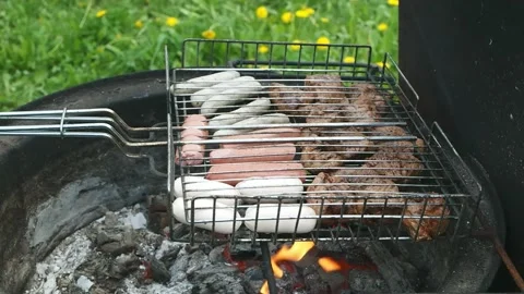 Closeup shot of making BBQ grill grade with meat and sausages Stock Footage 197491075