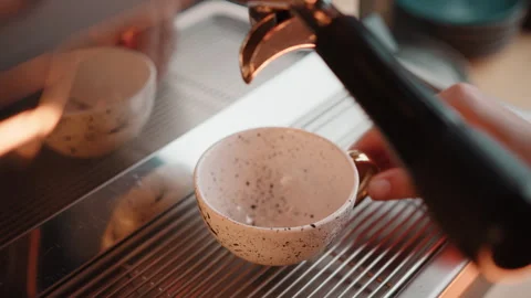 Closeup shot of making espresso at cafe. Steam coffee machine start pouring Stock Footage 245980395