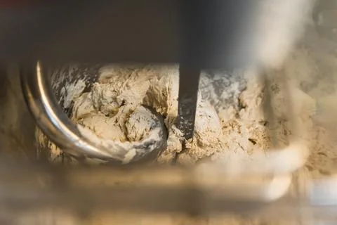 Closeup shot of making process by using flour mixing machine in the factory Stock Photos