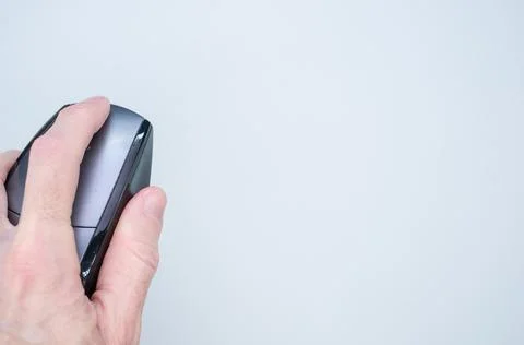 Closeup shot of a man hand using a computer mouse on a white background Stock Photos