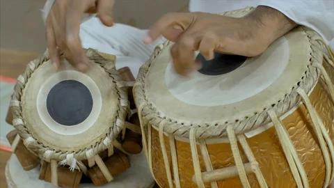 Closeup shot of a man playing the tabla drums - Indian Classical Music Stock-Footage 116953935
