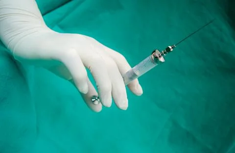 Closeup shot of a medical injection in hand Stock Photos