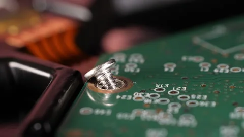 Closeup shot of a microchip of a hard drive and a screw. Selective focus. Stock Footage 264982812