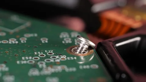 Closeup shot of a microchip of a hard drive and a screw. Selective focus. Stock Footage 278421237