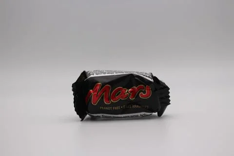 Closeup shot of a mini Mars chocolate bar wrapper on a white background Stock Photos