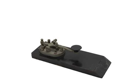 Closeup shot of a Morse code push-button gadget on a white background 스톡 사진