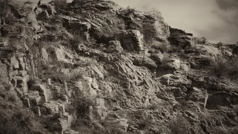 Closeup shot of Mountain with some cloud on the blue clear sky in black and w Foto stock