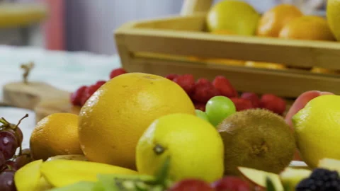 Closeup shot moving across various, delicious, fresh fruit in kitchen Stock Footage 341207064